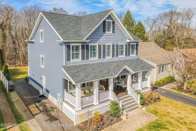 a aerial view of a house with a yard