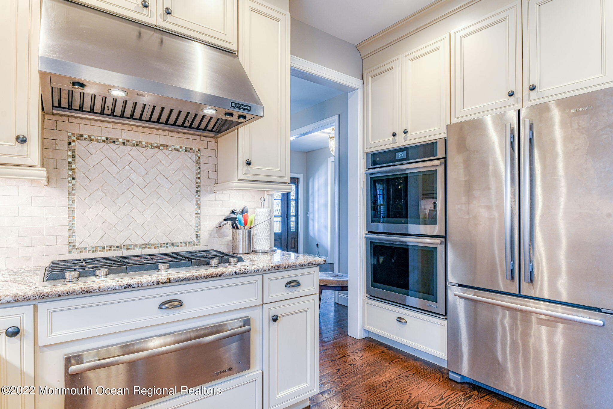 346 South Boulevard Spring Lake, NJ 07762 - Photo 24 of 56 a kitchen with granite countertop stainless steel appliances and wooden floor