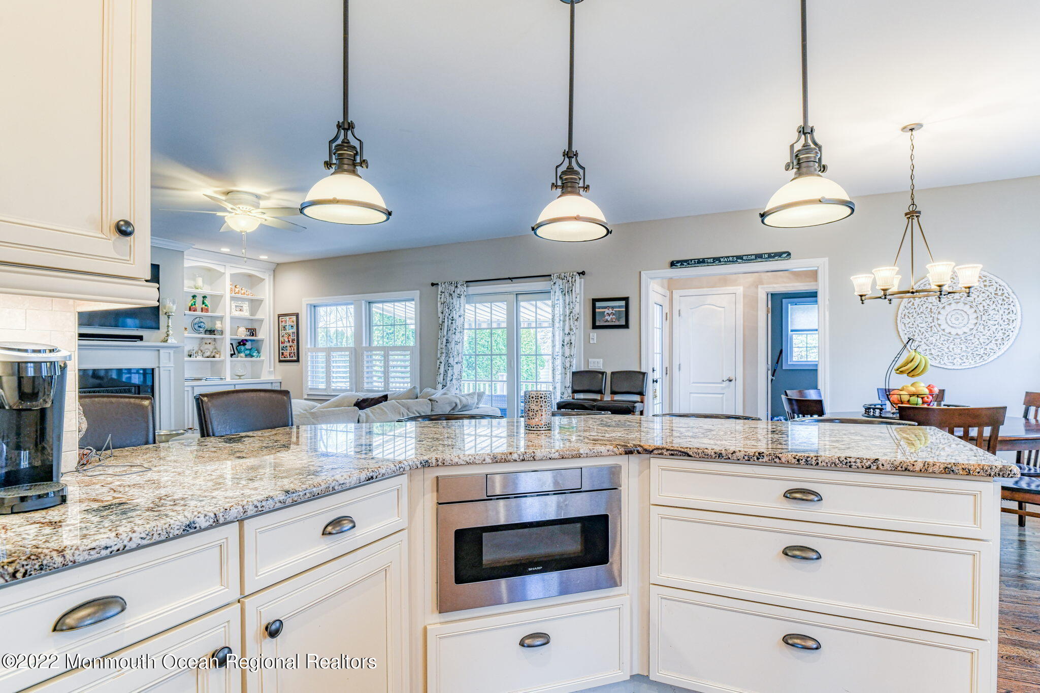 346 South Boulevard Spring Lake, NJ 07762 - Photo 26 of 56 a kitchen with granite countertop cabinets a stove a sink and a counter top space