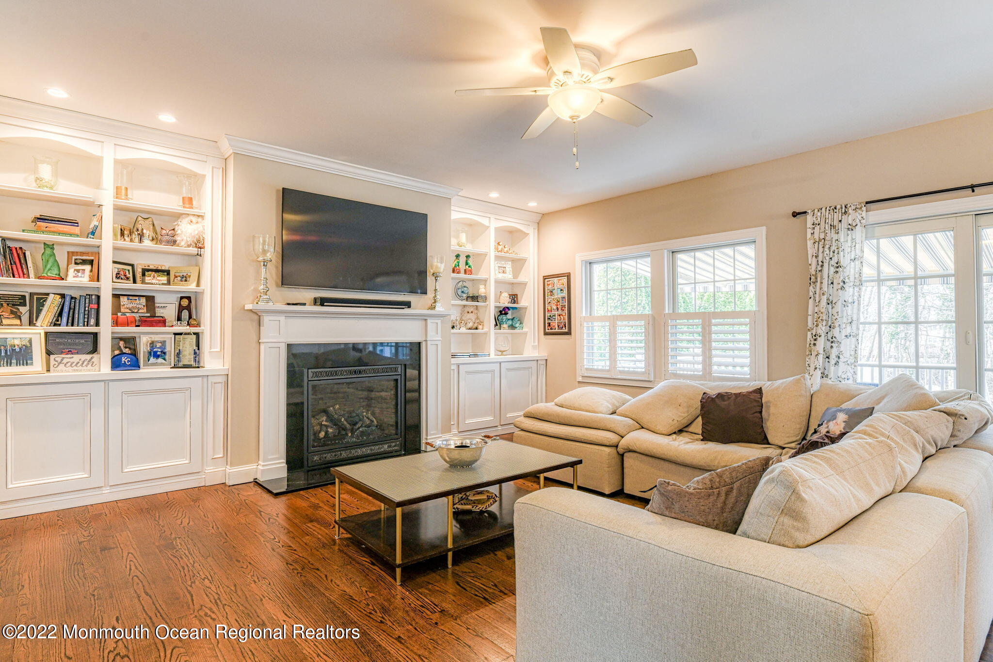 346 South Boulevard Spring Lake, NJ 07762 - Photo 27 of 56 a living room with furniture a flat screen tv and a fireplace