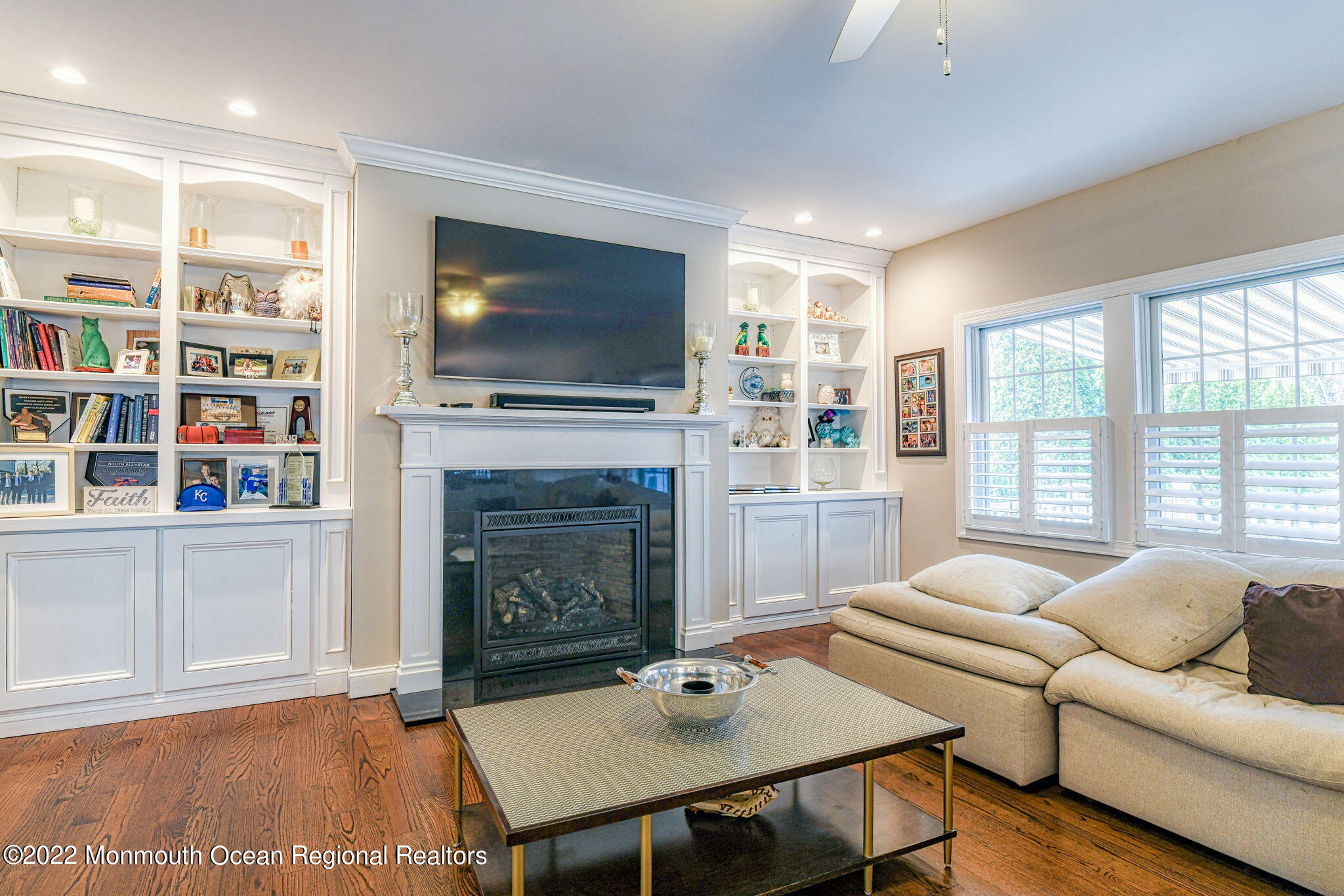 346 South Boulevard Spring Lake, NJ 07762 - Photo 28 of 56 a living room with furniture a flat screen tv and a fireplace