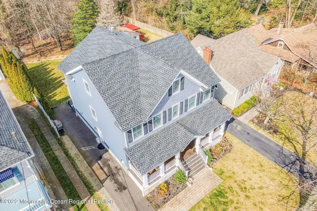 a aerial view of a house with swimming pool