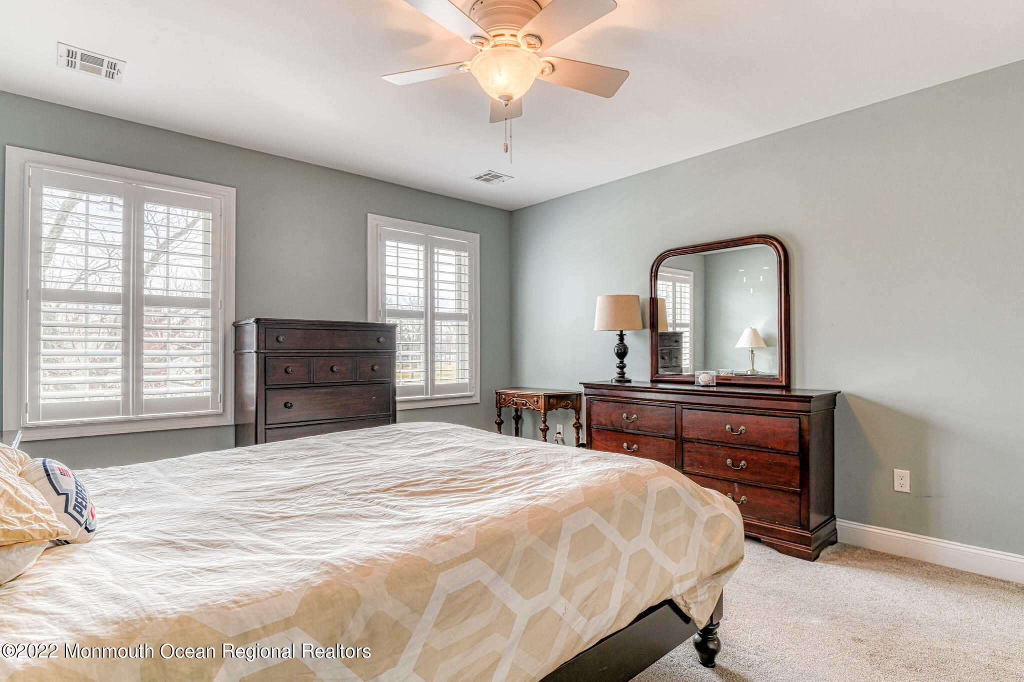 346 South Boulevard Spring Lake, NJ 07762 - Photo 34 of 56 a bedroom with a bed and a dresser with mirror
