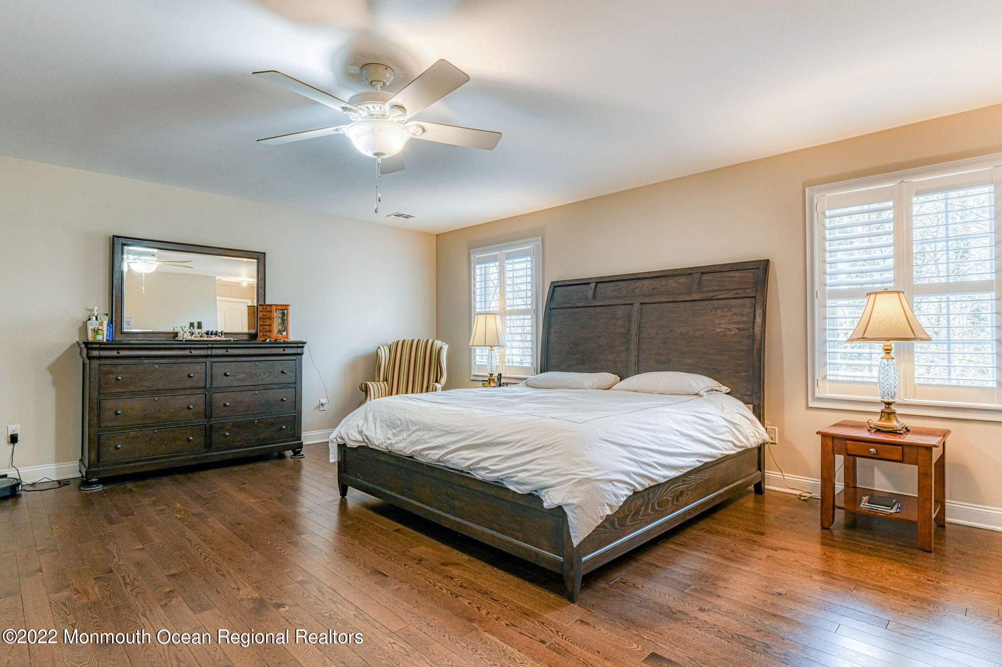 346 South Boulevard Spring Lake, NJ 07762 - Photo 36 of 56 a bedroom with a bed and a chandelier