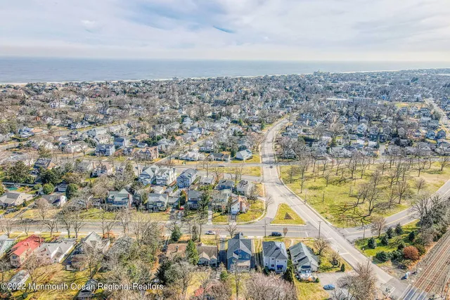 a living room with furniture a fireplace and a table