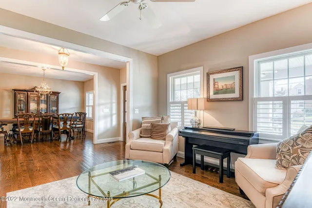 a living room with fireplace furniture and a flat screen tv