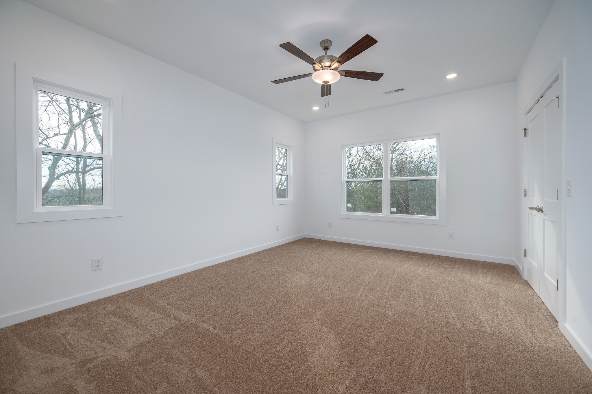 1170 Dickerson Road, Unit 22 Goodlettsville, TN 37072 - Photo 12 of 34 an empty room with windows and fan