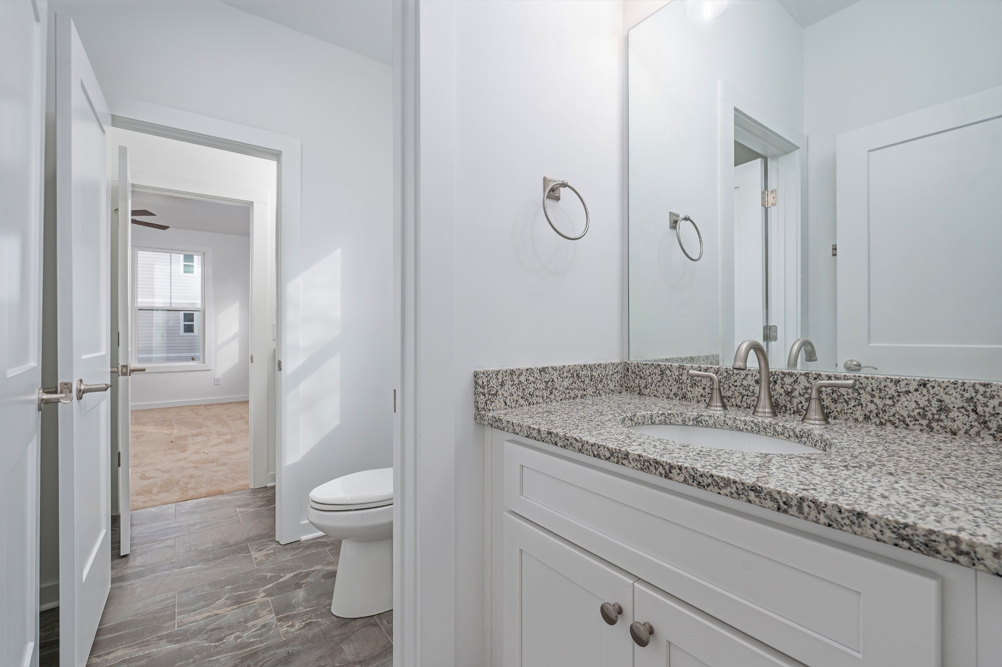 1170 Dickerson Road, Unit 22 Goodlettsville, TN 37072 - Photo 14 of 34 a bathroom with a granite countertop sink a toilet and a shower