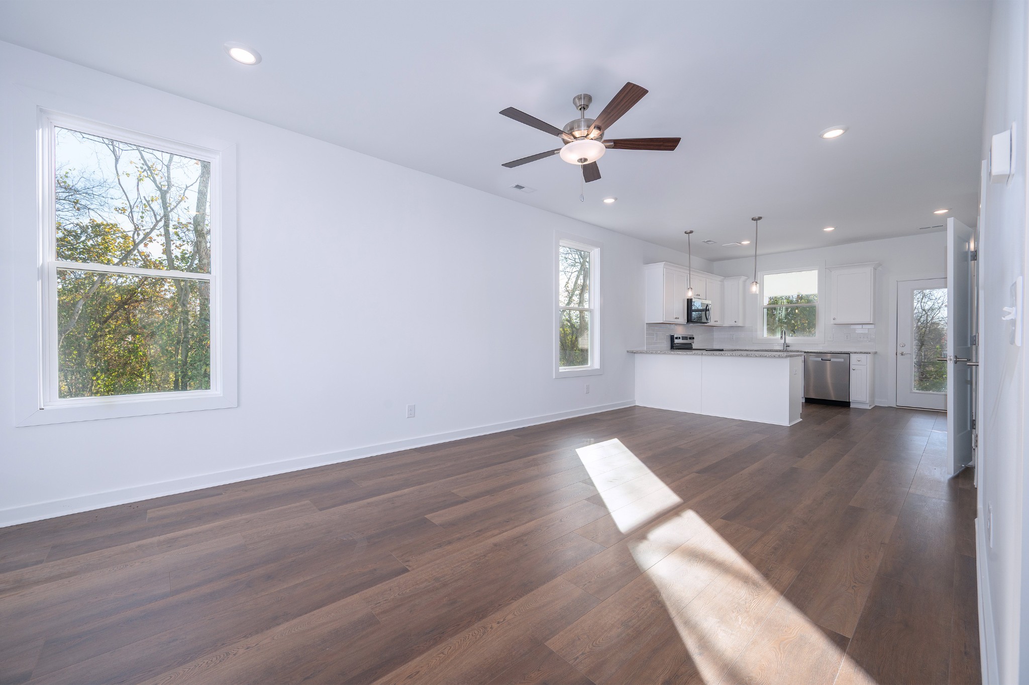 1170 Dickerson Road, Unit 22 Goodlettsville, TN 37072 - Photo 2 of 34 a view of an empty room with wooden floor and a window