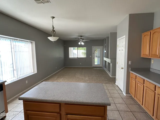a view of livingroom with kitchen and window