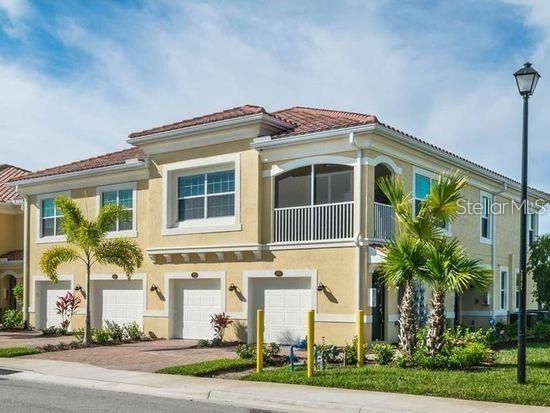 232 Explorer Drive Osprey, FL 34229 - Photo 1 of 1 a front view of a house with a yard