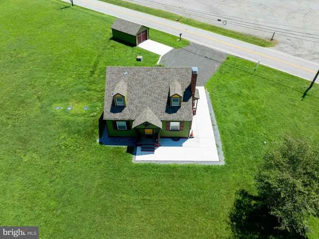 a view of a house with small yard