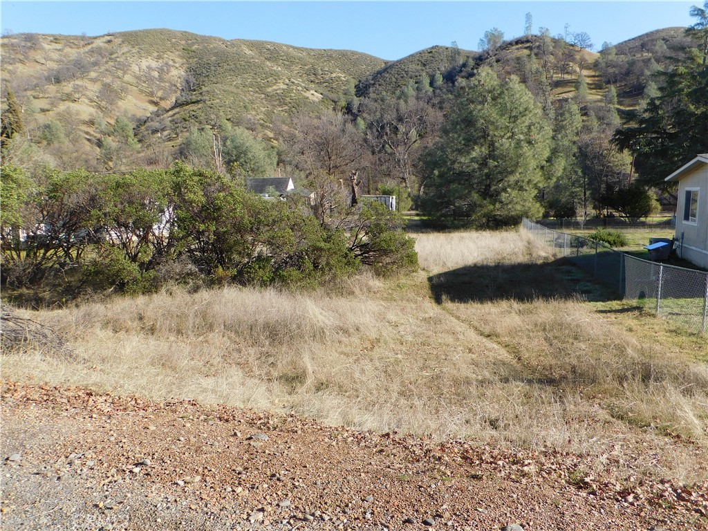 3660 Spring Valley Road Clearlake Oaks, CA 95423 - Photo 2 of 6 a view of a large body of water with a building in the background