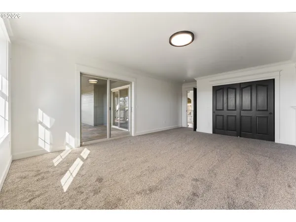 a view of hallway with wooden floor