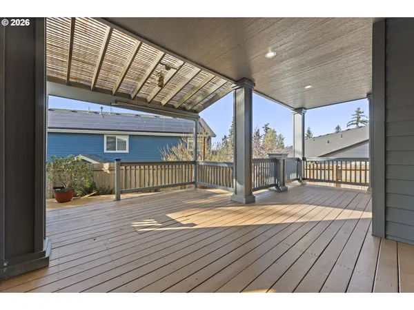 a view of a balcony with chair and wooden floor