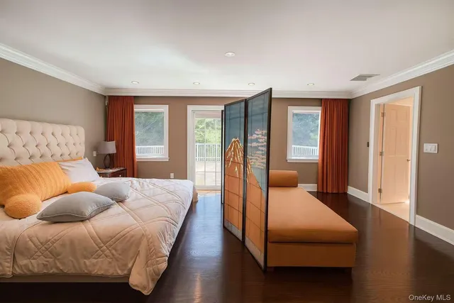 a bedroom with a large bed and a couch