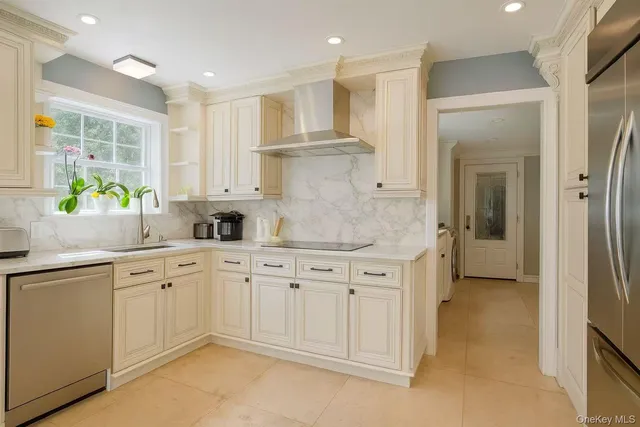 a kitchen with granite countertop white cabinets and white appliances