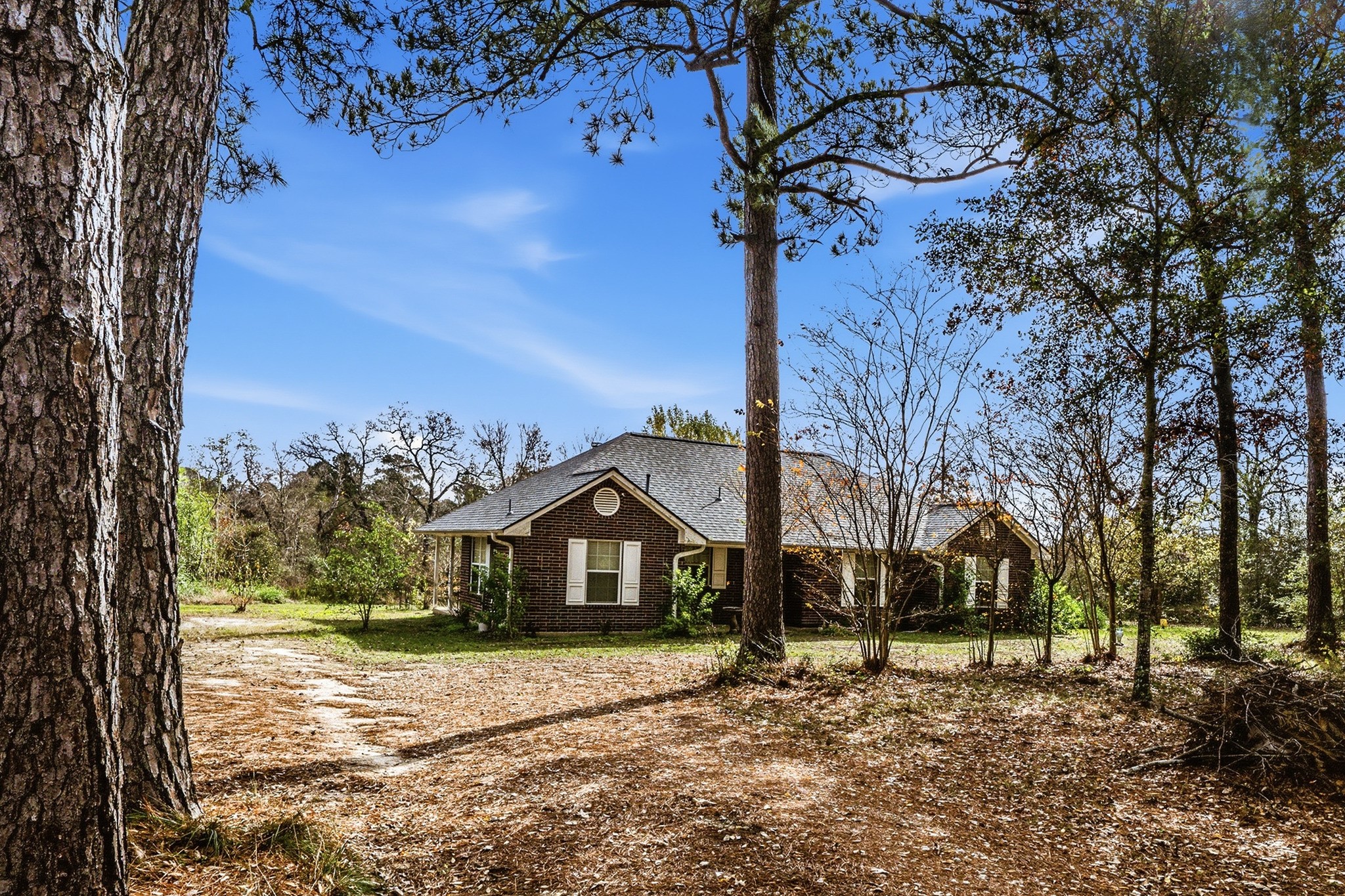 691 Bishop Road Huntsville, TX 77320 - Photo 32 of 32 a view of a house with a yard