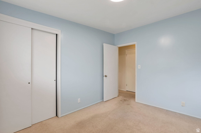 447 550 South Bountiful, UT 84010 - Photo 19 of 25 Interior room featuring light blue walls and beige carpet flooring