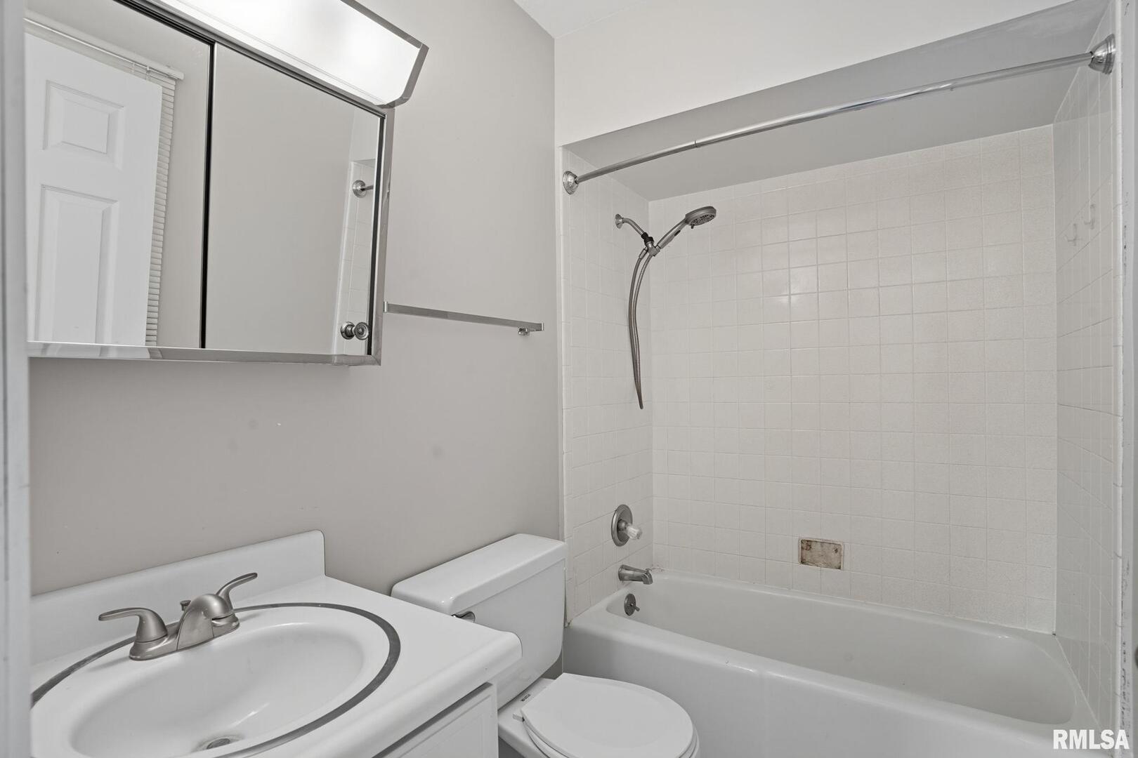 109 North 3rd Street Colona, IL 61241 - Photo 22 of 33 a bathroom with a sink toilet and shower