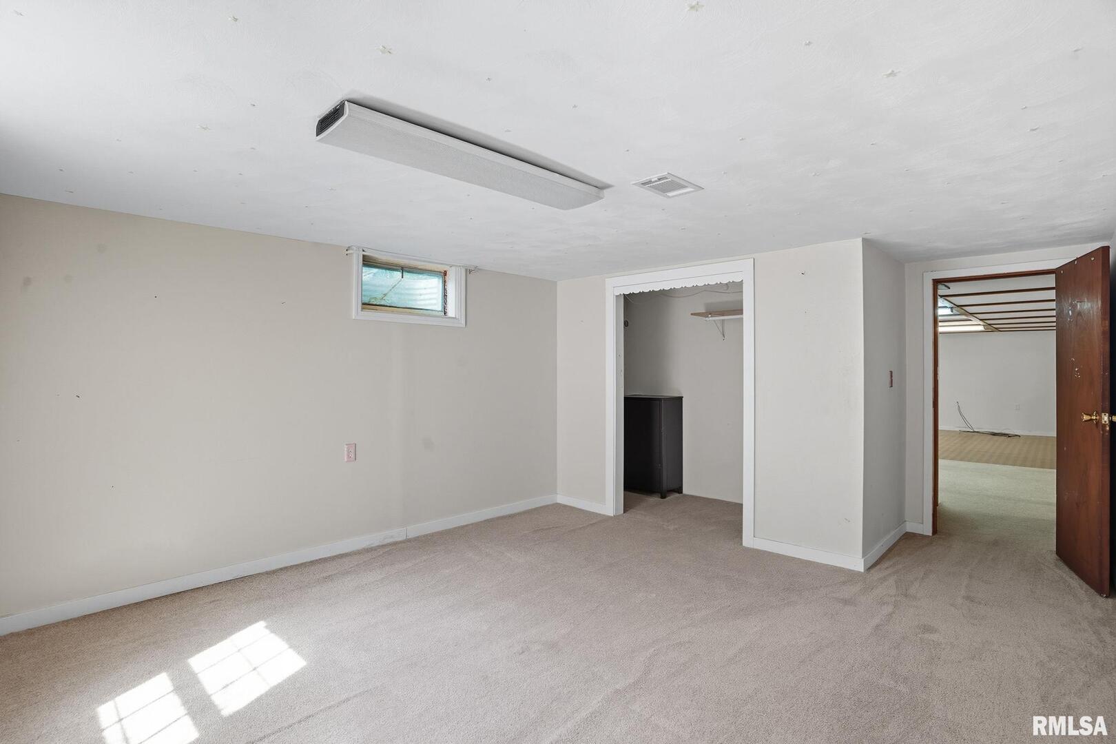109 North 3rd Street Colona, IL 61241 - Photo 26 of 33 a view of an empty room with a window