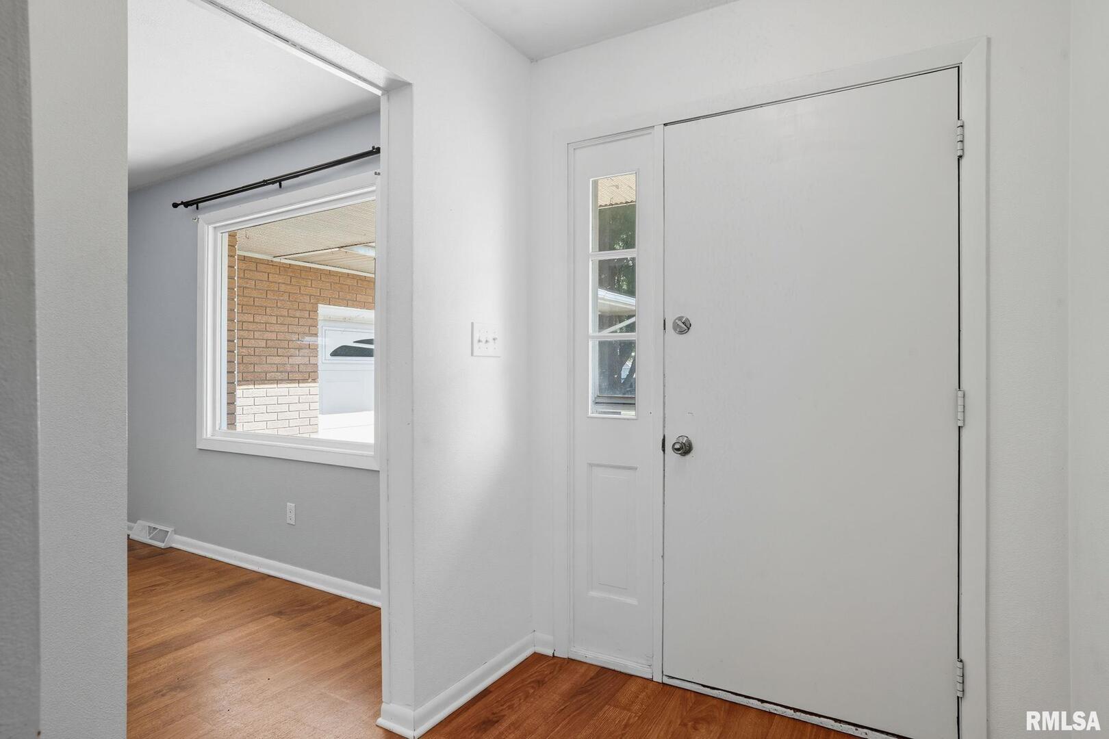 109 North 3rd Street Colona, IL 61241 - Photo 3 of 33 a view of an empty room with closet and a window