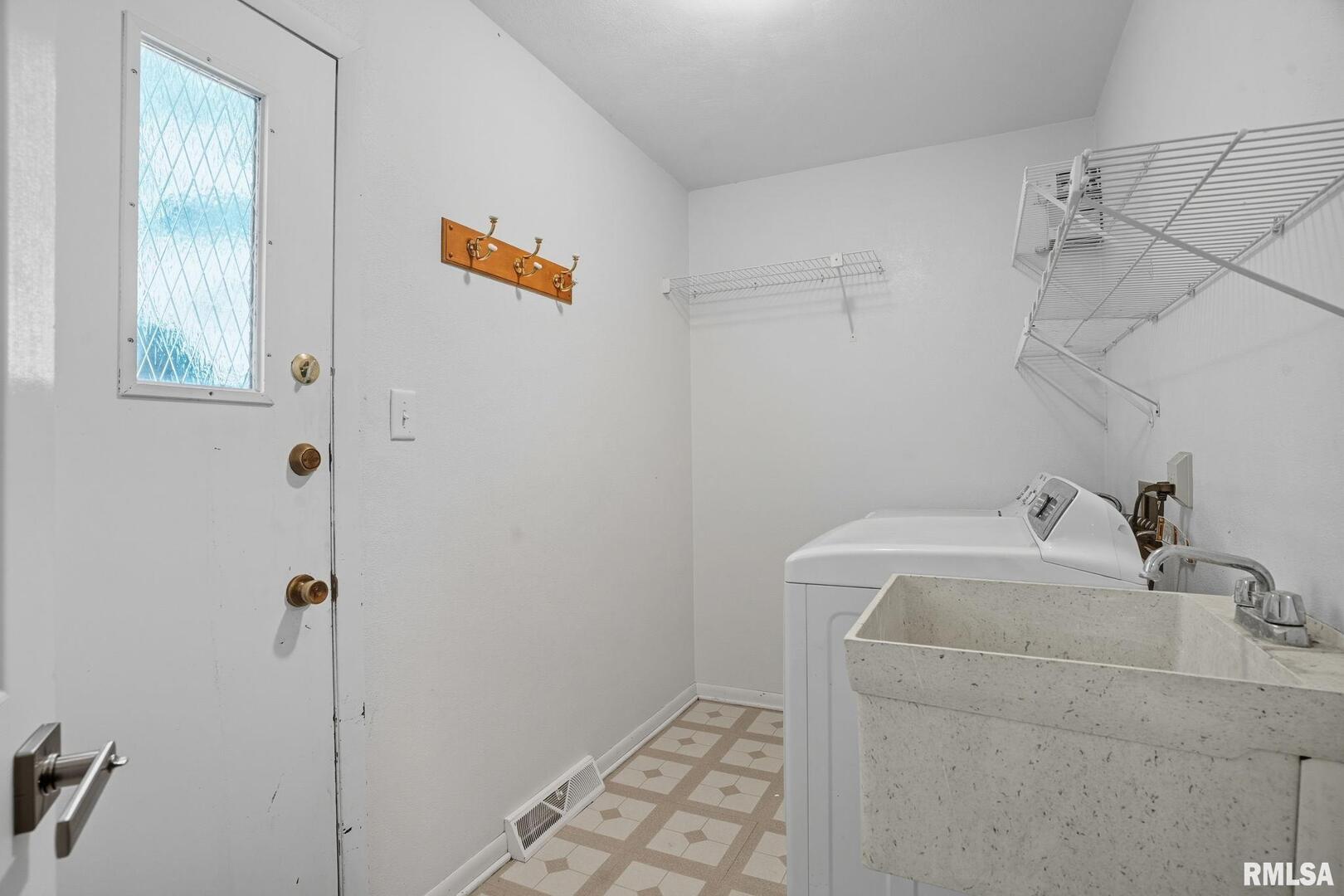 109 North 3rd Street Colona, IL 61241 - Photo 9 of 33 a bathroom with a sink and a vanity