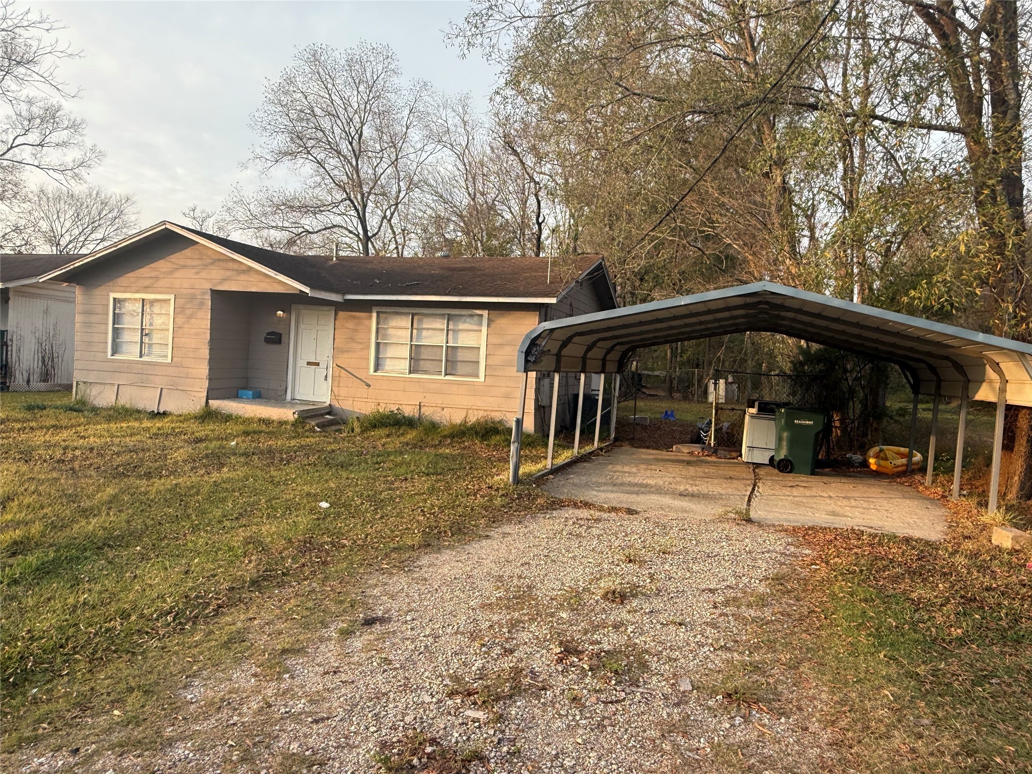 a view of a house with a yard and garage