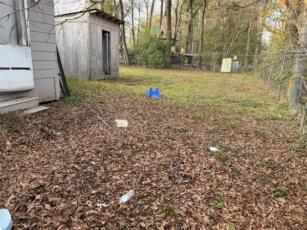 a view of outdoor space with deck and yard