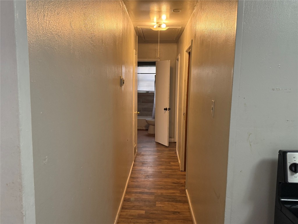 2210 Utica Street Beaumont, TX 77703 - Photo 4 of 17 a view of a hallway with wooden floor