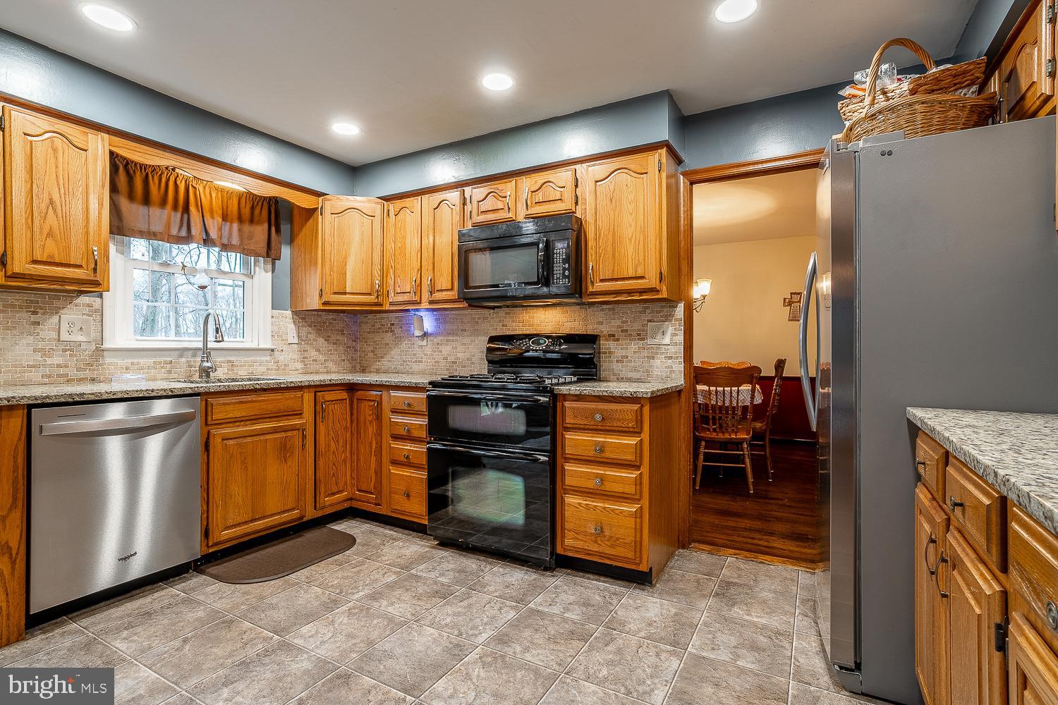 421 Hampton Lane Somerdale, NJ 08083 - Photo 11 of 35 a kitchen with stainless steel appliances granite countertop a stove a sink and a microwave
