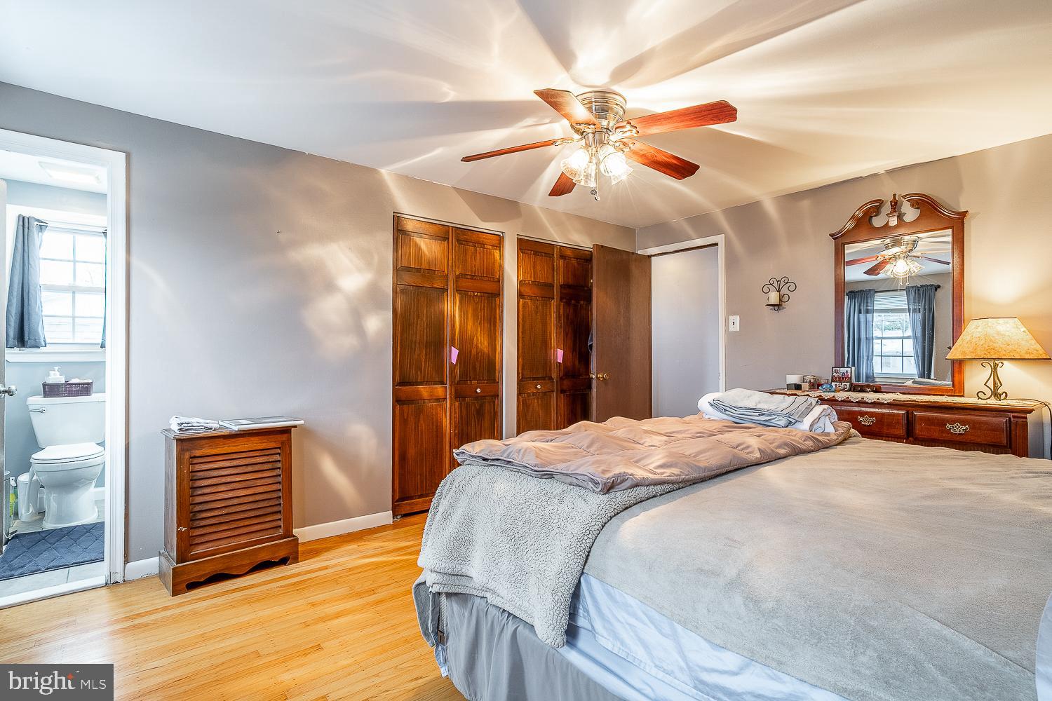 421 Hampton Lane Somerdale, NJ 08083 - Photo 25 of 35 a bedroom with a bed and a chandelier