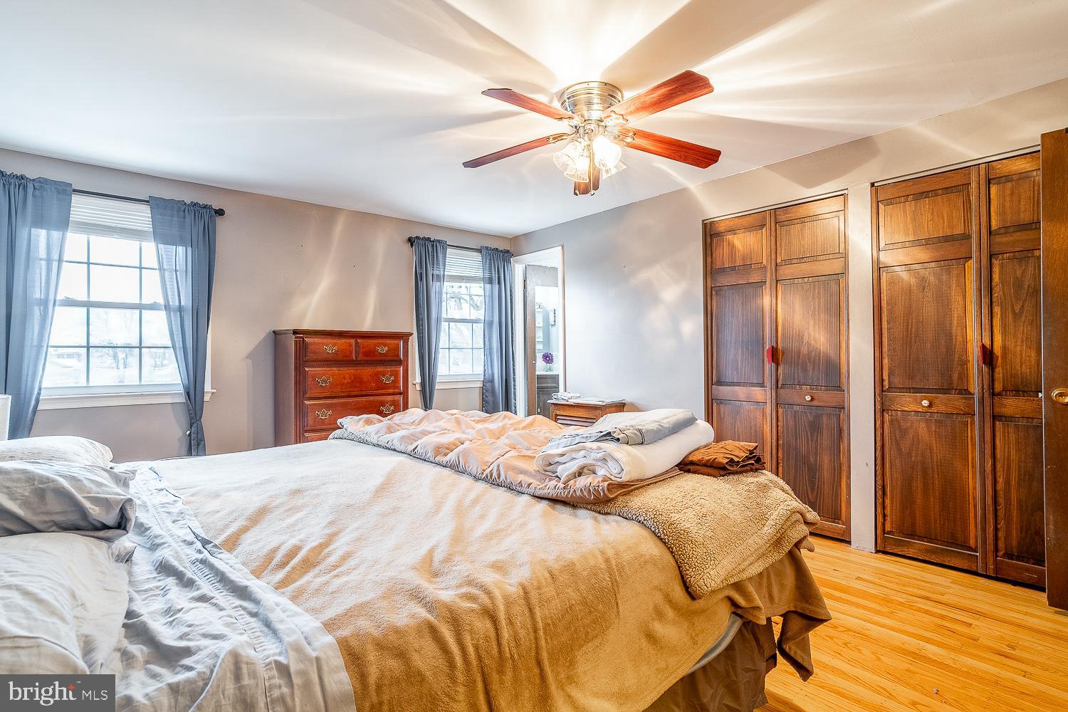 421 Hampton Lane Somerdale, NJ 08083 - Photo 26 of 35 a bedroom with a bed and a chandelier