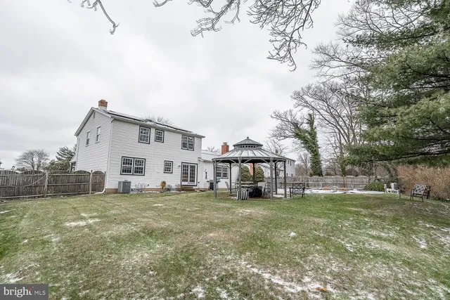 a view of backyard with a table and chairs