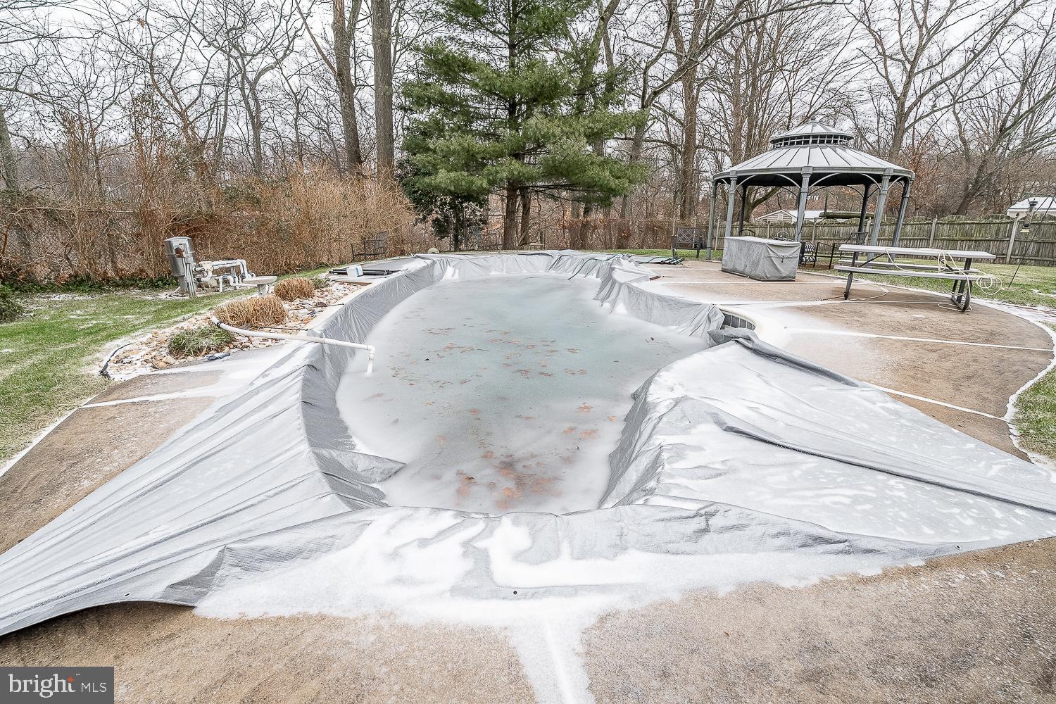 421 Hampton Lane Somerdale, NJ 08083 - Photo 32 of 35 a view of a backyard with table and chairs under an umbrella