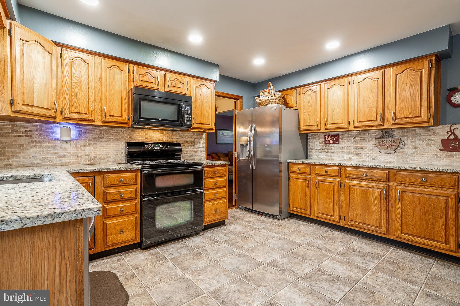 421 Hampton Lane Somerdale, NJ 08083 - Photo 10 of 35 a kitchen with stainless steel appliances granite countertop a stove a sink and a microwave