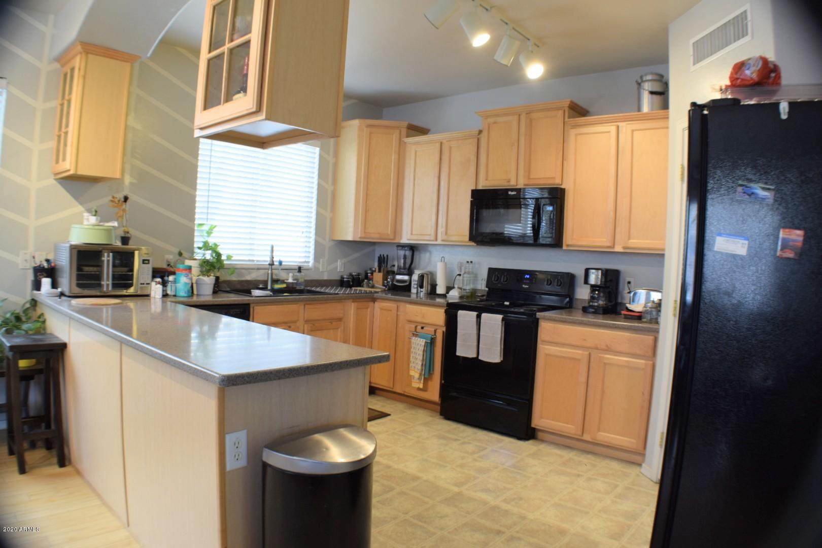 3942 West Carter Road Phoenix, AZ 85041 - Photo 8 of 23 DSC_0105