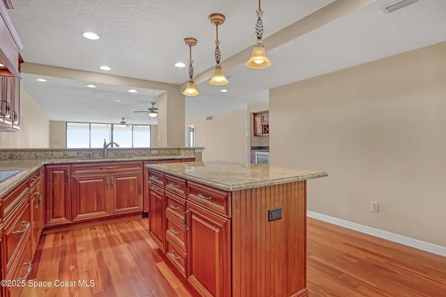a view of a room with sliding door and wooden floor