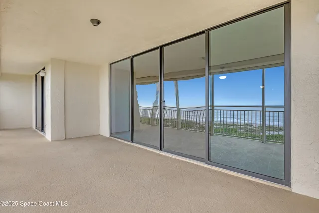 a bathroom with a granite countertop sink a mirror a vanity and a shower