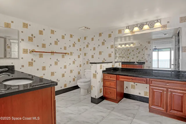 a living room with furniture and a painting