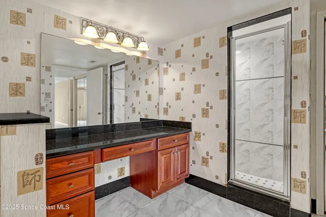 a kitchen with kitchen island granite countertop a stove sink microwave and refrigerator