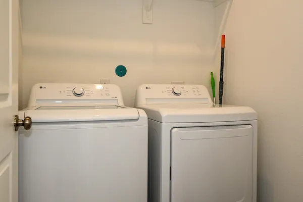 a utility room with dryer and washer