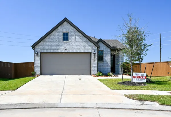 a front view of house with garage and yard