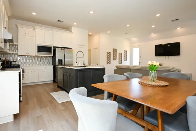 a view of a backyard with sitting area