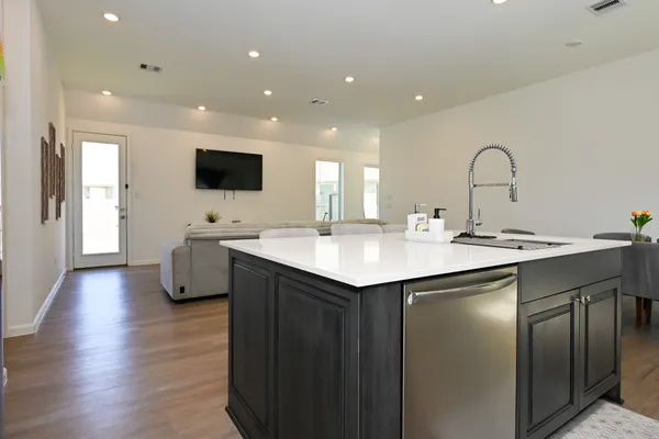 a kitchen with a sink and a large window