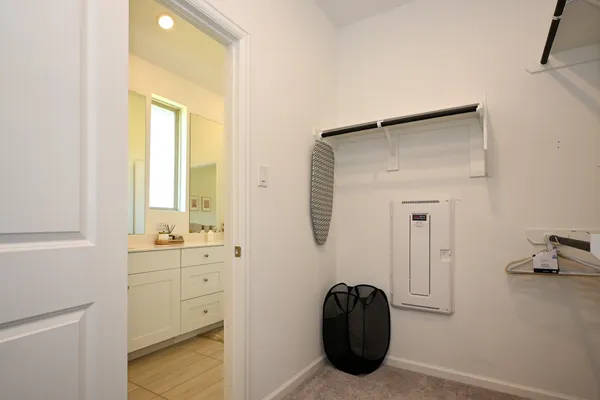 a view of a closet and utility room