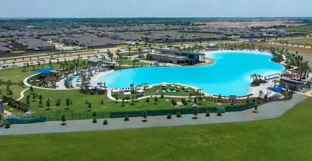 a bathroom with a toilet and a shower curtain
