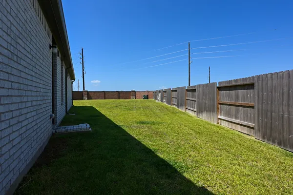 a view of a backyard with sitting area