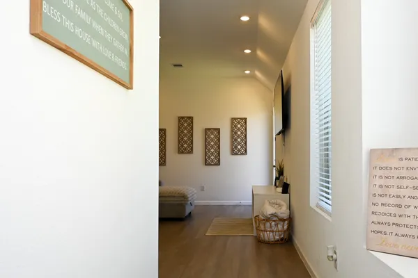 a bathroom with a toilet and a shower curtain