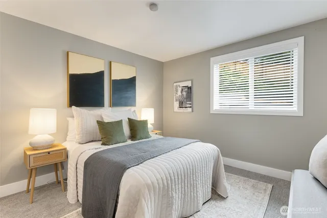 a bedroom with a bed and window